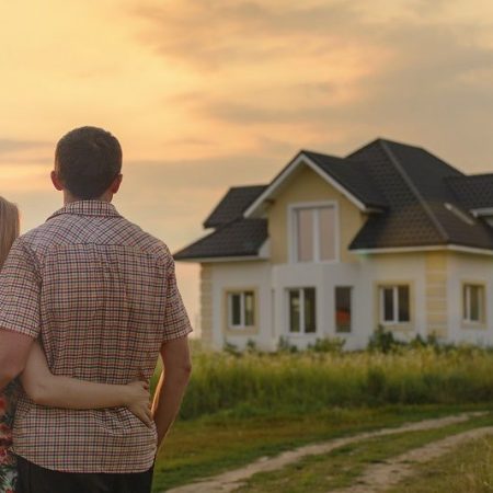 Couple in Front of House